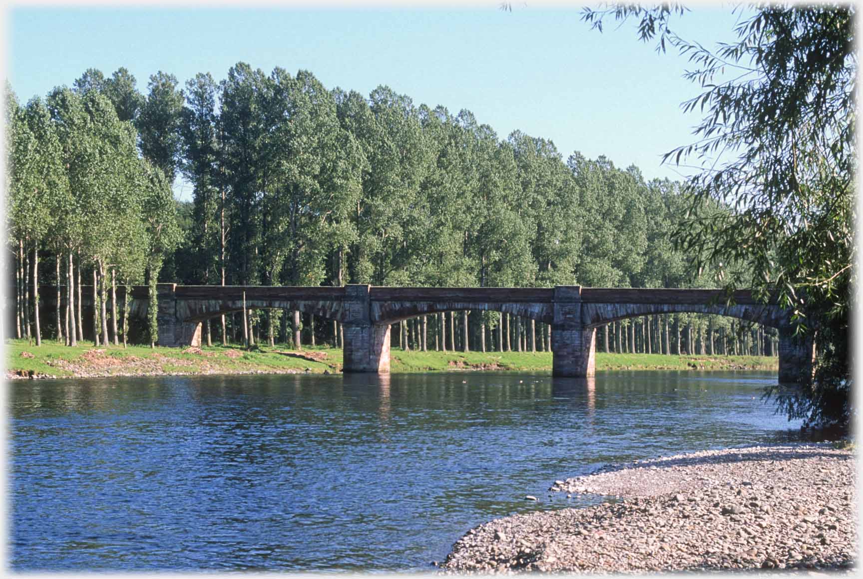 Bridge with trees beyond.