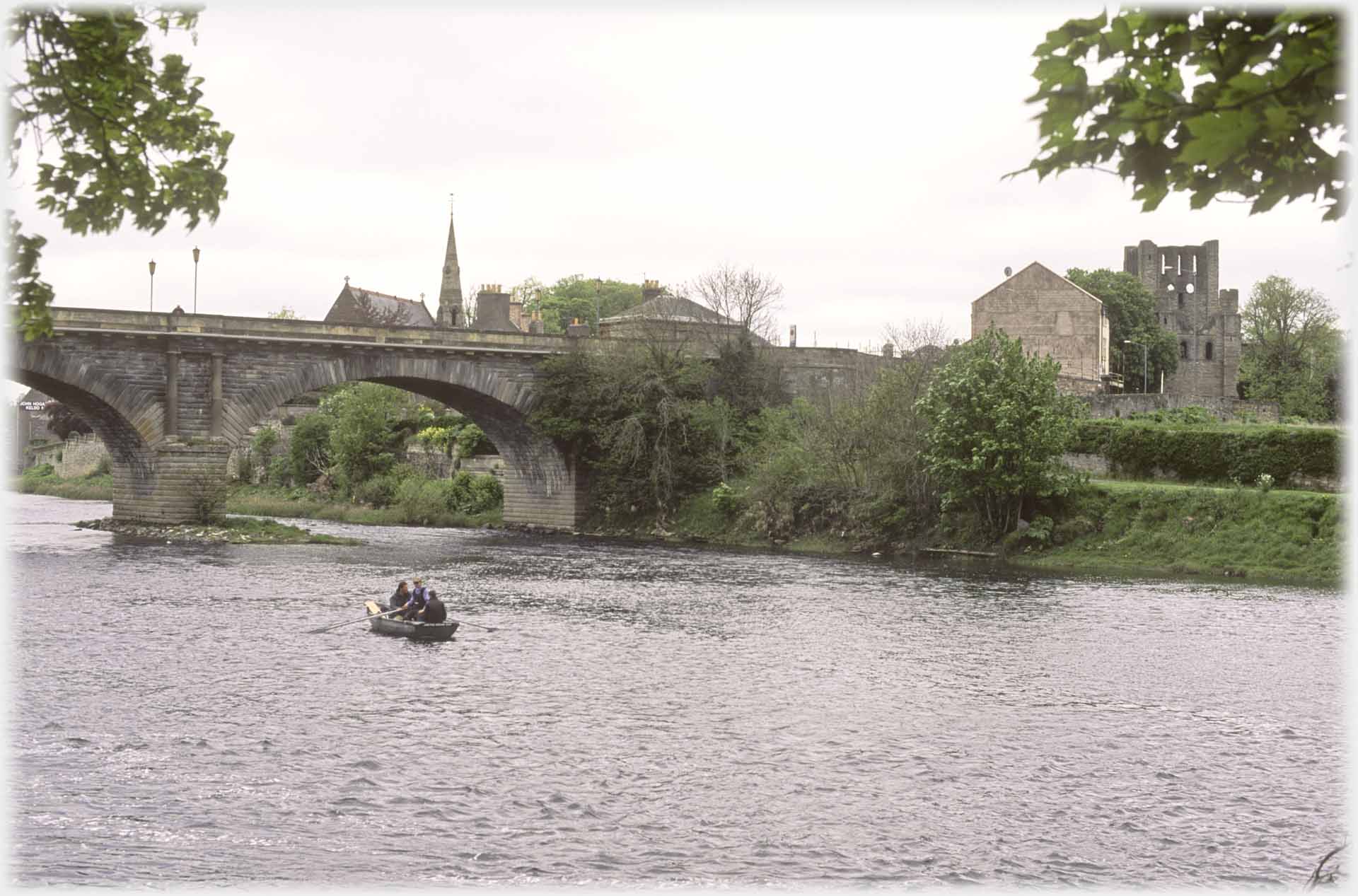 Bridge spire and ruined building.