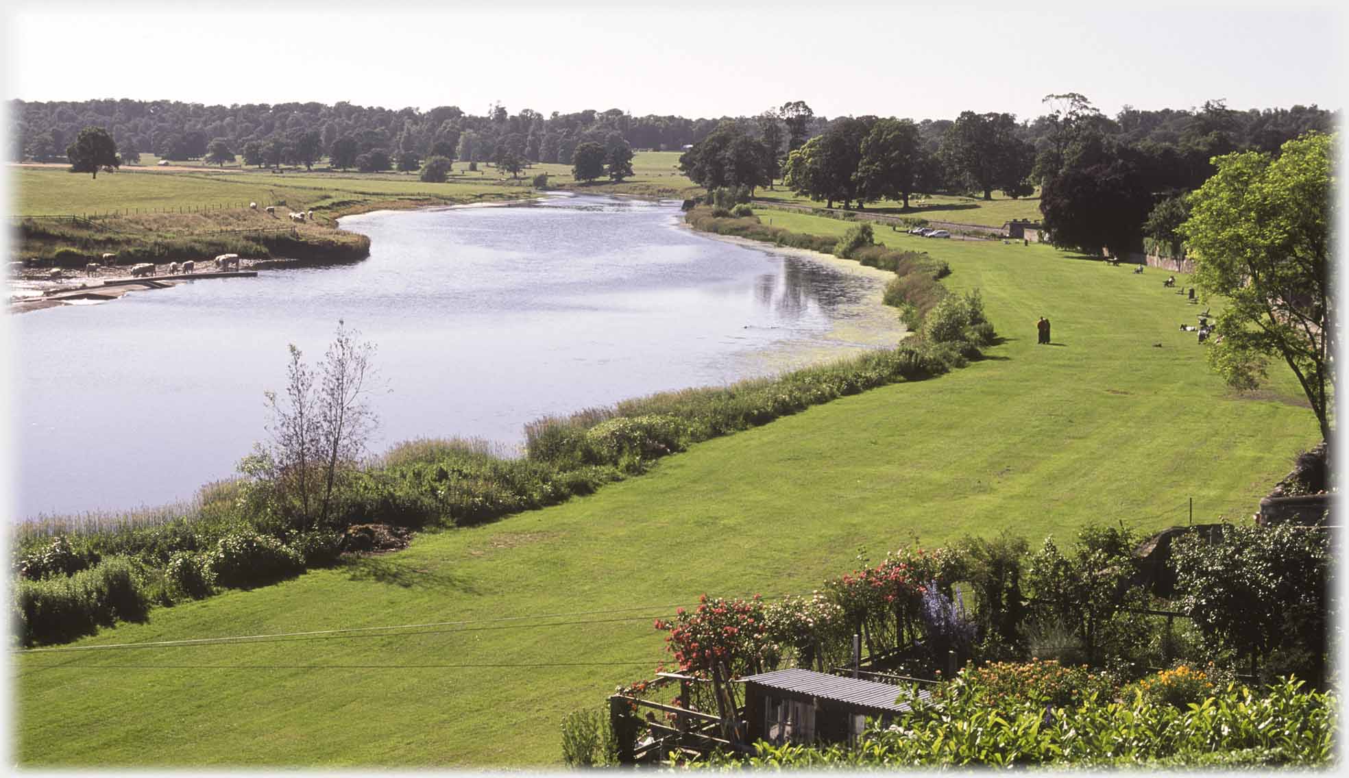 River curving away with wide grass margin.