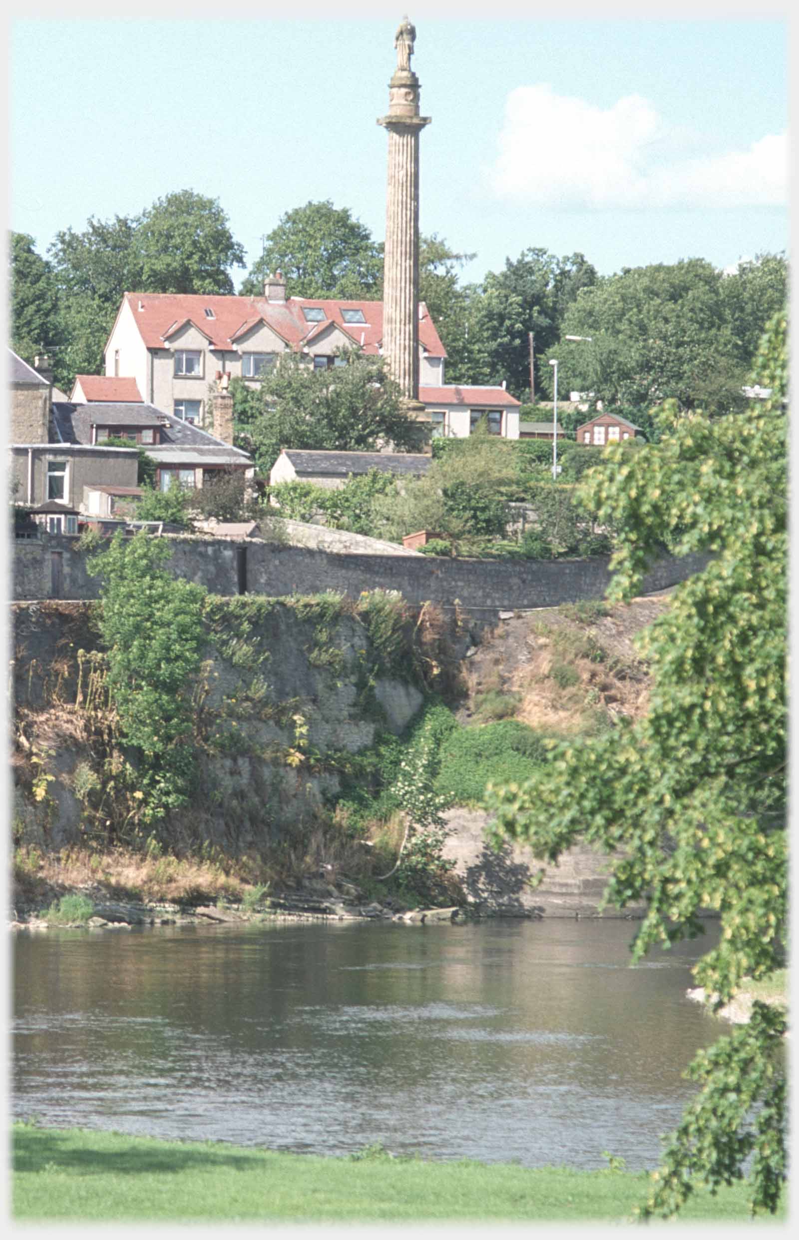 Column by house above river