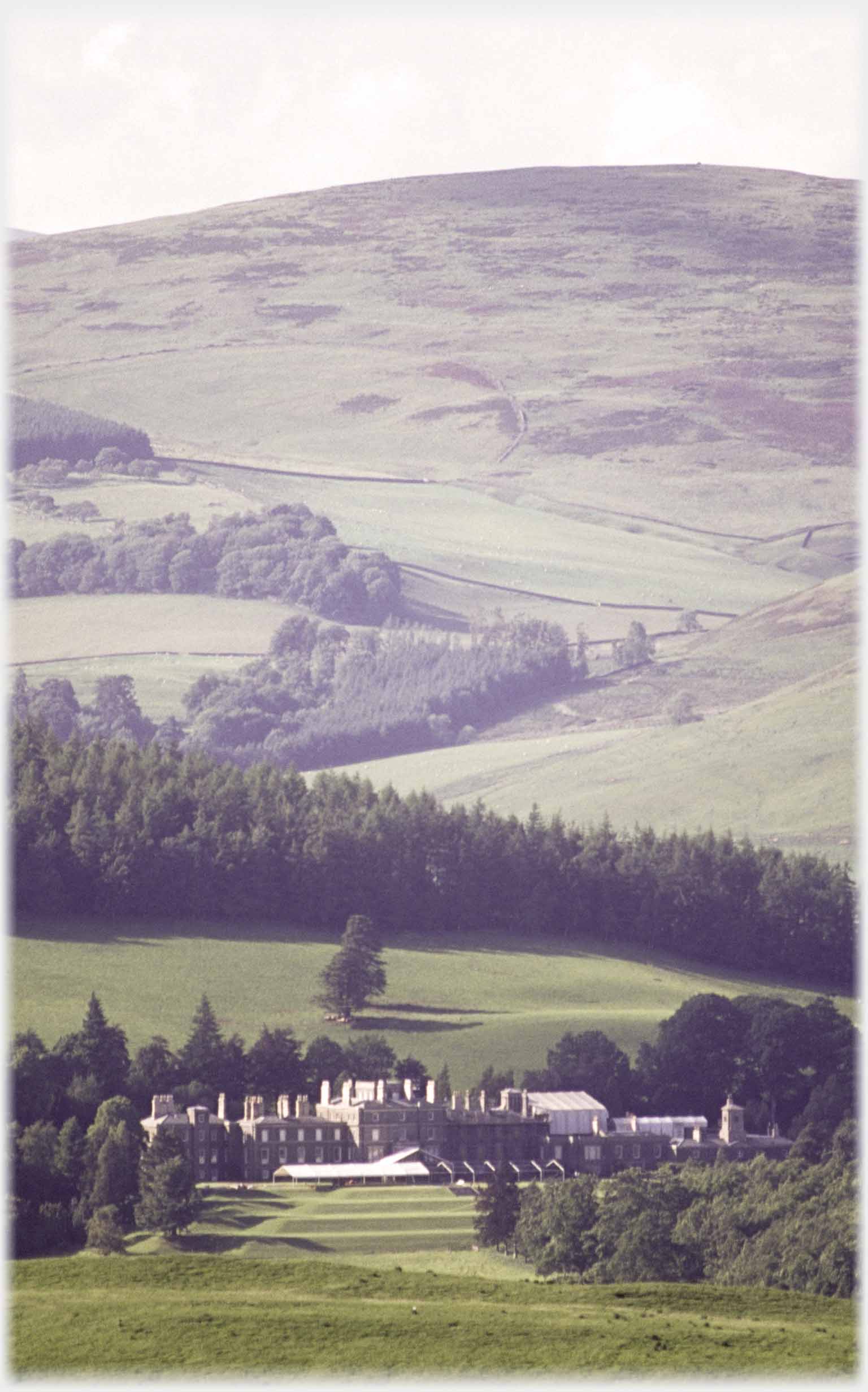 Closer view of the large house in last photo, hill rising behind.