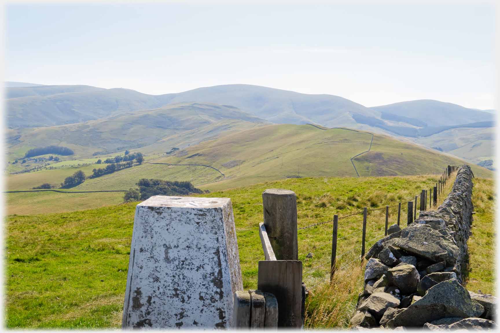 Triangulation point with fence and dyke running away from it.