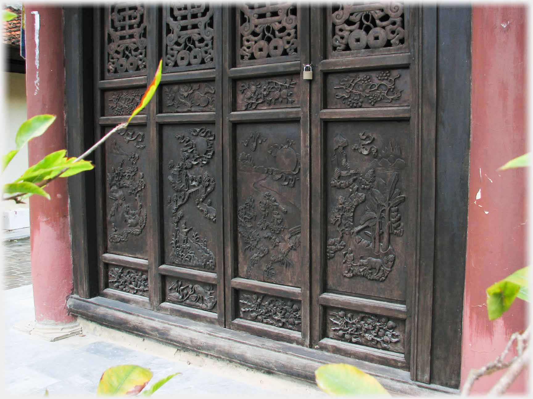 Four section door with relief carvings.