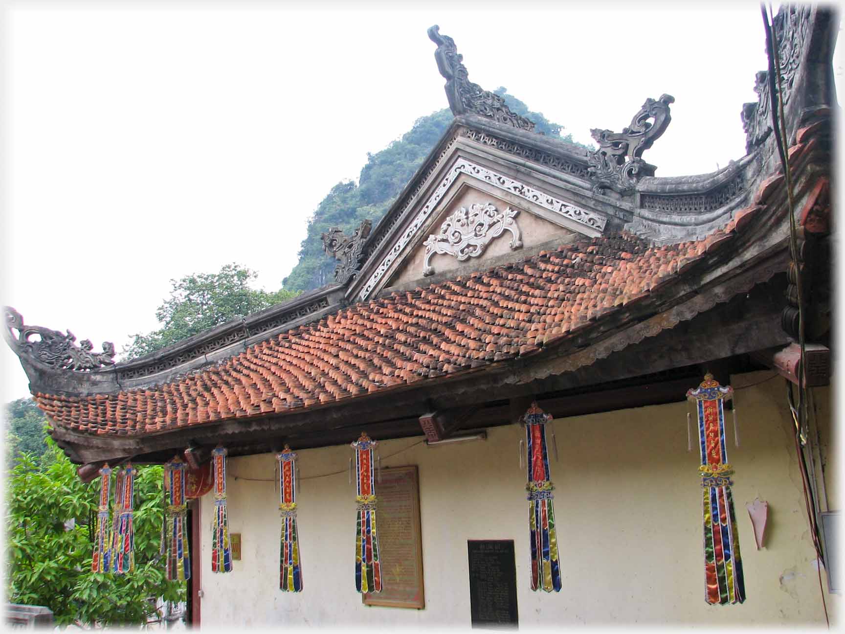 Decorated roof and eves giving overhanging porch.