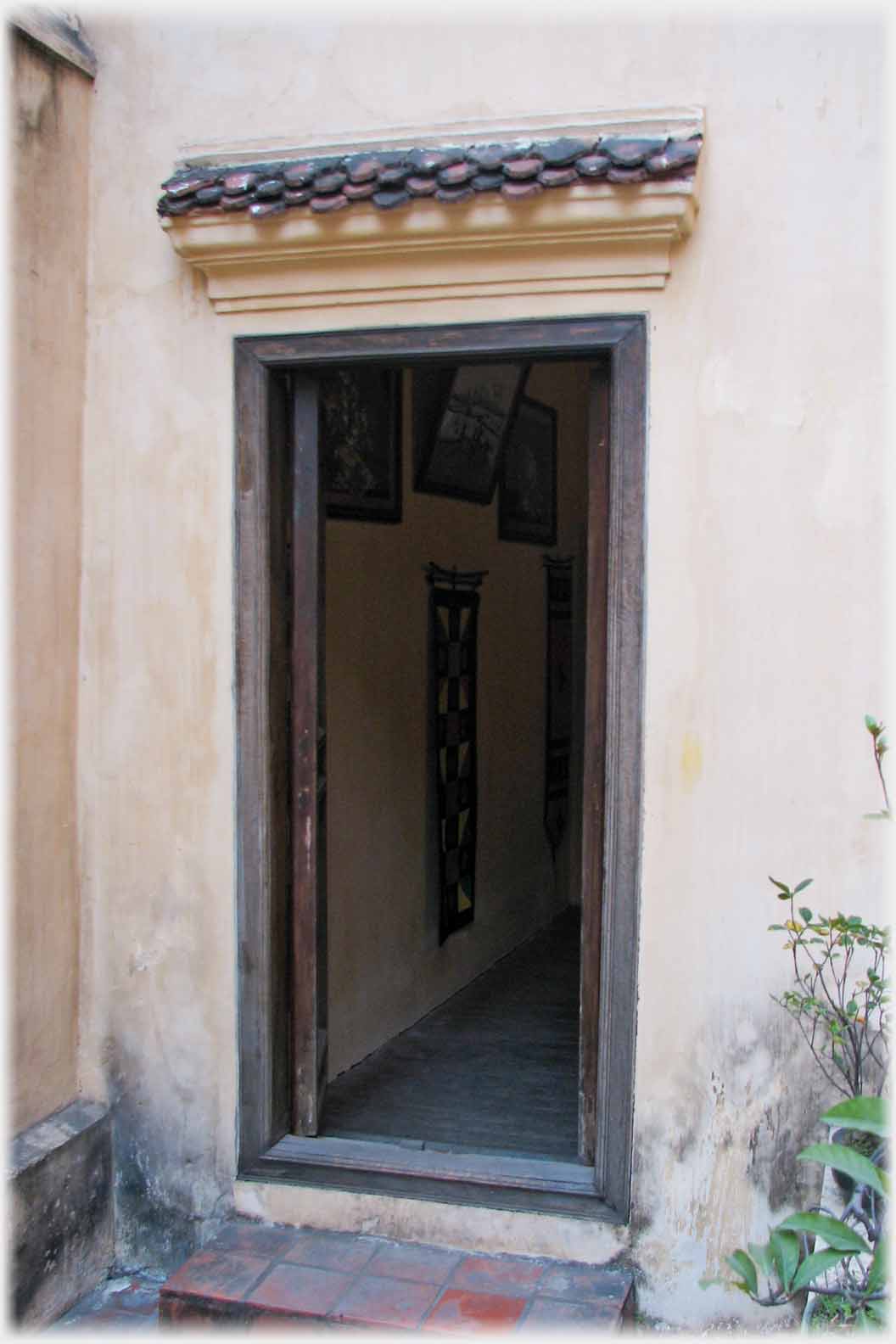 Open door with horizontal slight porch over.