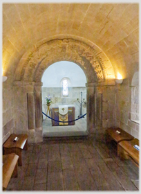 Interior of chapel with rounded arch.