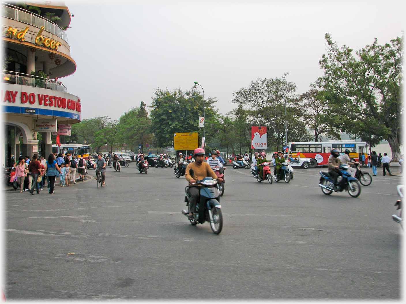 Open square with a sprinkling of motorbikes.