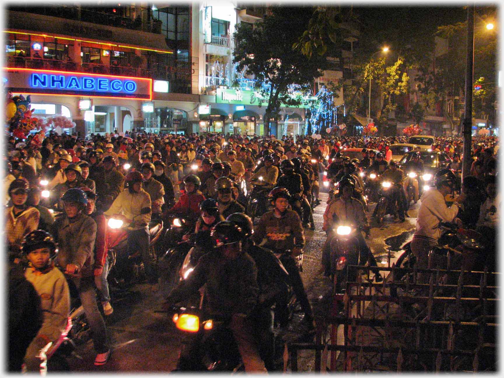 Crowds on motorbikes on street stretching as far as can be seen.