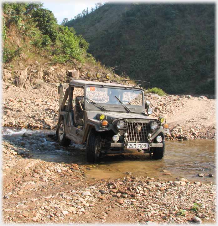 Jeep apparently parked in a stream.