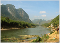 River valley with large floating collections of bamboos.